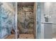 Stunning shower room featuring unique stone design, glass doors, and stylish fixtures at 2747 Paradise Rd # Ph 3604, Las Vegas, NV 89109