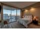 Bedroom with large glass doors opening to a balcony and city view at 2747 Paradise Rd # Ph 3604, Las Vegas, NV 89109