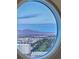 Picturesque city and mountain views through a round window at 2747 Paradise Rd # Ph 3604, Las Vegas, NV 89109