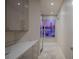 Hallway with Golden Gate Bridge art, built in cabinets, and light neutral color palette at 2747 Paradise Rd # Ph 3604, Las Vegas, NV 89109