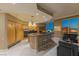 Modern kitchen featuring an island, sleek appliances, and an open layout with stunning city views beyond floor-to-ceiling windows at 2747 Paradise Rd # Ph 3604, Las Vegas, NV 89109