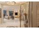 Modern living room with marble floors, entertainment center, and access to beautiful city views at 2747 Paradise Rd # Ph 3604, Las Vegas, NV 89109