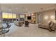Bright living room with marble floors, entertainment center, city views, and plenty of seating at 2747 Paradise Rd # Ph 3604, Las Vegas, NV 89109