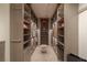 Well-organized walk-in closet featuring custom shelving, drawers, and a central ottoman for added convenience at 2747 Paradise Rd # Ph 3604, Las Vegas, NV 89109