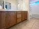 Bathroom featuring double sinks and a shower-tub combination with modern fixtures at 2756 Blairgowrie Dr, Henderson, NV 89044