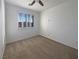 Light-filled bedroom featuring carpet flooring, a ceiling fan, and shuttered windows at 2756 Blairgowrie Dr, Henderson, NV 89044