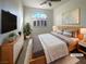 Inviting main bedroom featuring an arched window, a ceiling fan, and neutral decor at 2756 Blairgowrie Dr, Henderson, NV 89044