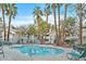 Community pool featuring ample seating, palm trees and convenient resident access at 3061 Key Largo Dr # 201, Las Vegas, NV 89120