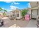 Cozy backyard patio area, great for relaxing or entertaining with a small pink playhouse at 4301 Fortune Ave, Las Vegas, NV 89107