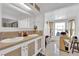 Bright bathroom featuring double sinks and a sunny window-lit vanity area at 4301 Fortune Ave, Las Vegas, NV 89107