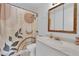 Bright bathroom featuring vanity with marble countertop and decorative mirror at 4301 Fortune Ave, Las Vegas, NV 89107