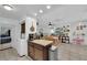 Bright dining area with wood table, decor and access to other rooms in home at 4301 Fortune Ave, Las Vegas, NV 89107