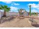 Desert landscaping with rocks, cacti, and palm trees create a unique curb appeal at 4301 Fortune Ave, Las Vegas, NV 89107