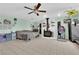 Open living room featuring a fireplace, ceiling fan, and tile flooring at 4301 Fortune Ave, Las Vegas, NV 89107