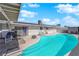 Inviting backyard swimming pool with patio, seating, and covered deck at 4301 Fortune Ave, Las Vegas, NV 89107