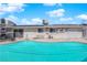 Backyard swimming pool with surrounding patio space and exterior home features at 4301 Fortune Ave, Las Vegas, NV 89107