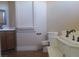 Well lit bathroom with tub, toilet, sink, and tile flooring at 4320 Tiger Rd, Pahrump, NV 89048