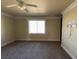 Comfortable bedroom featuring carpet flooring, neutral paint and bright window at 4320 Tiger Rd, Pahrump, NV 89048