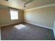 Bright bedroom with neutral walls, carpet flooring and a window at 4320 Tiger Rd, Pahrump, NV 89048