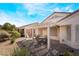 Peaceful backyard featuring a covered patio and desert landscaping at 502 Edgefield Ridge Pl, Henderson, NV 89012