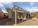 Cozy backyard with a covered patio, perfect for outdoor dining and entertaining in a tranquil setting at 502 Edgefield Ridge Pl, Henderson, NV 89012