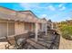 Private backyard patio with shade structure and comfortable seating, great for outdoor gatherings at 502 Edgefield Ridge Pl, Henderson, NV 89012