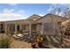 Charming backyard featuring a covered patio area, ideal for relaxing and enjoying outdoor living space at 502 Edgefield Ridge Pl, Henderson, NV 89012