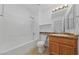 A bright bathroom featuring a tub, toilet, and vanity at 502 Edgefield Ridge Pl, Henderson, NV 89012