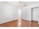 This bedroom boasts hardwood floors, a closet, a ceiling fan, and a door at 502 Edgefield Ridge Pl, Henderson, NV 89012