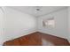 Bright bedroom features a ceiling fan, hardwood floors, and a window at 502 Edgefield Ridge Pl, Henderson, NV 89012