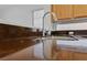 Close-up of kitchen sink with stainless steel faucet and countertop at 502 Edgefield Ridge Pl, Henderson, NV 89012