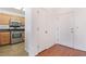 Hallway view of kitchen with stainless steel appliances and wood cabinets at 502 Edgefield Ridge Pl, Henderson, NV 89012