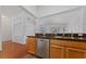 Bright open kitchen with modern stainless steel appliances and wood cabinets at 502 Edgefield Ridge Pl, Henderson, NV 89012