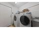 Functional laundry room equipped with appliances and ample storage space at 502 Edgefield Ridge Pl, Henderson, NV 89012