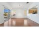 Spacious living room featuring hardwood floors and a view of the kitchen at 502 Edgefield Ridge Pl, Henderson, NV 89012