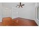 Well-lit living room features a ceiling fan and hardwood flooring at 502 Edgefield Ridge Pl, Henderson, NV 89012