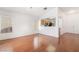 Cozy living room featuring hardwood floors and an open kitchen view at 502 Edgefield Ridge Pl, Henderson, NV 89012