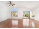 Bright and airy living room with hardwood floors and sliding glass doors at 502 Edgefield Ridge Pl, Henderson, NV 89012