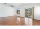 Bright and airy living room with hardwood floors and sliding glass doors to the backyard at 502 Edgefield Ridge Pl, Henderson, NV 89012