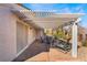 Charming covered patio with neutral tones, ideal for relaxation and outdoor dining at 502 Edgefield Ridge Pl, Henderson, NV 89012