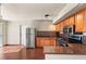 Well-lit kitchen featuring wood cabinets, stainless steel appliances, and sleek countertops at 5166 Gray Ln # M, Las Vegas, NV 89119