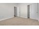 Bright bedroom featuring neutral carpeting, fresh paint, and closet at 5323 Farley Feather Ct, North Las Vegas, NV 89031