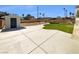 Backyard featuring concrete patio, grass lawn, and utility shed at 5413 Avenida Caballo, Las Vegas, NV 89108