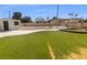 Backyard with artificial lawn, utility shed, and backyard fence at 5413 Avenida Caballo, Las Vegas, NV 89108