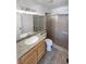 Bathroom with granite countertop and tiled walk-in shower at 5413 Avenida Caballo, Las Vegas, NV 89108