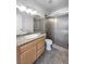 Bathroom with granite countertop and tiled walk-in shower at 5413 Avenida Caballo, Las Vegas, NV 89108