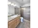 Bathroom with granite countertop and tiled walk-in shower at 5413 Avenida Caballo, Las Vegas, NV 89108