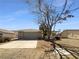 Charming single-story home featuring a two-car garage, desert landscaping, and classic brick accents at 5413 Avenida Caballo, Las Vegas, NV 89108