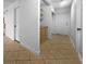 Hallway leading to storage and kitchen with tan tile at 5413 Avenida Caballo, Las Vegas, NV 89108