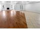 Spacious living room featuring a fireplace, recessed lighting, and combination wood and tile flooring at 5413 Avenida Caballo, Las Vegas, NV 89108